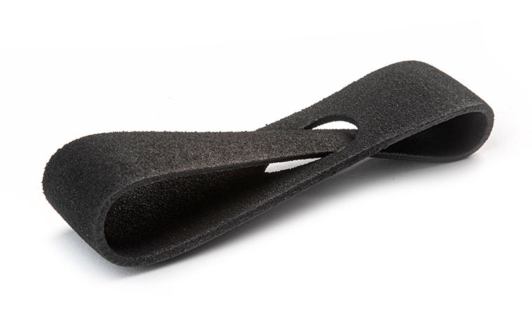 A black 3D-printed loop made from Ultrasint TPU 90A-01 using Multi Jet Fusion, finished with matte paint and a 10% percent gloss.