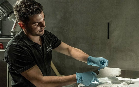 Materialise team member checks 3D-printed orthotics