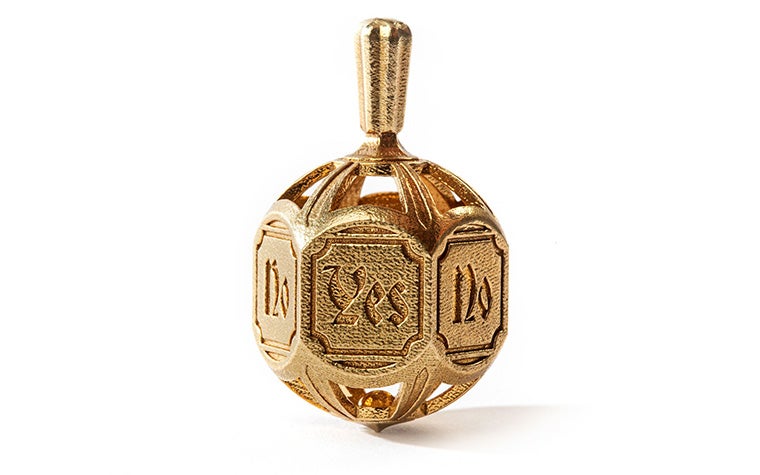 A detailed decision-making spinning top embossed with the words "yes" and "no". Made in brass using lost-wax casting.