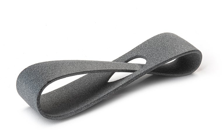 A gray 3D-printed loop made from PA12 (MJF) using Multi Jet Fusion, with a normal finish.