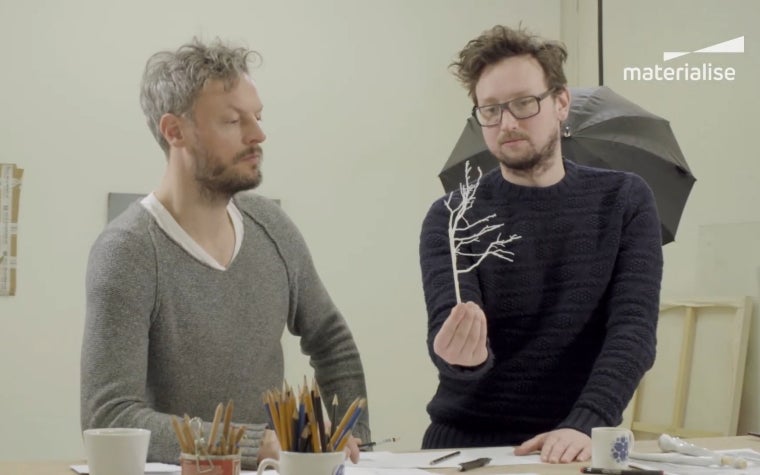 Artists  Lutz Rainer Mueller and Stian Adlandsvik looking on the prototype of the bronze tree