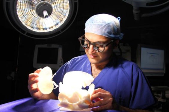 Surgeon holding a 3D-printed kidney model