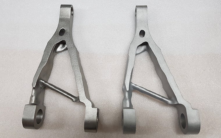 Triangular metal aerospace part. 