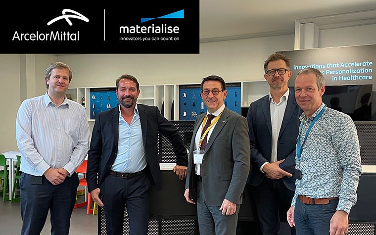 Group photo of representatives from ArcelorMittal and Materialise