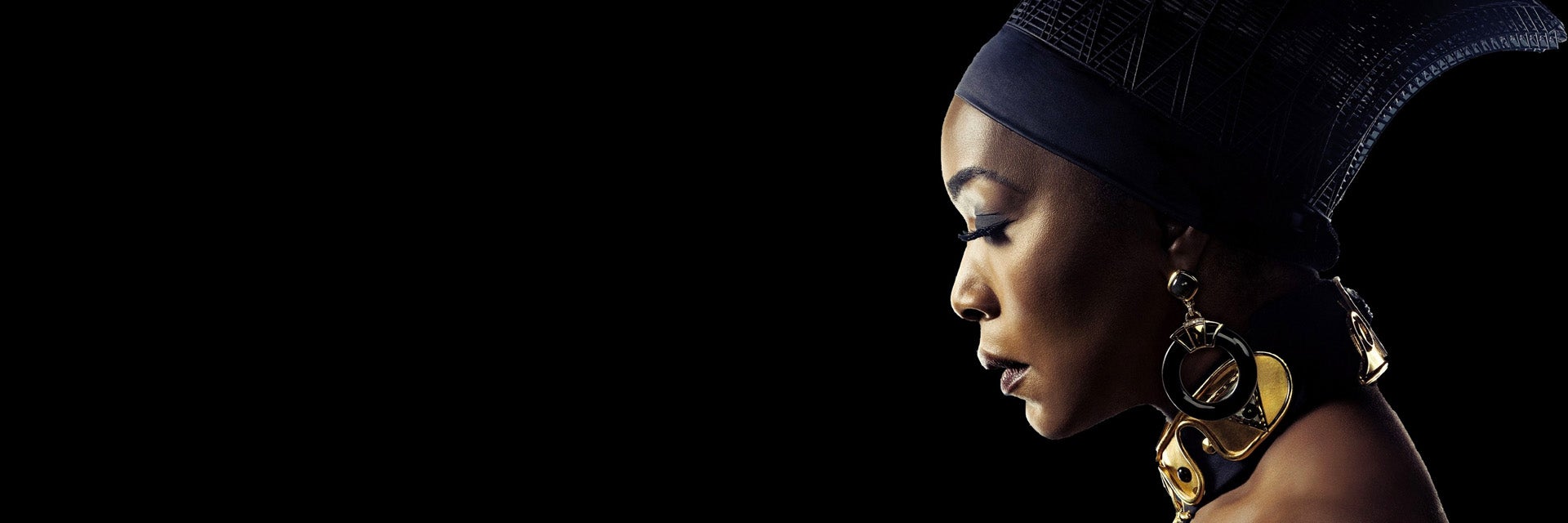 Profile view of Angela Bassett dressed in her Black Panther costume