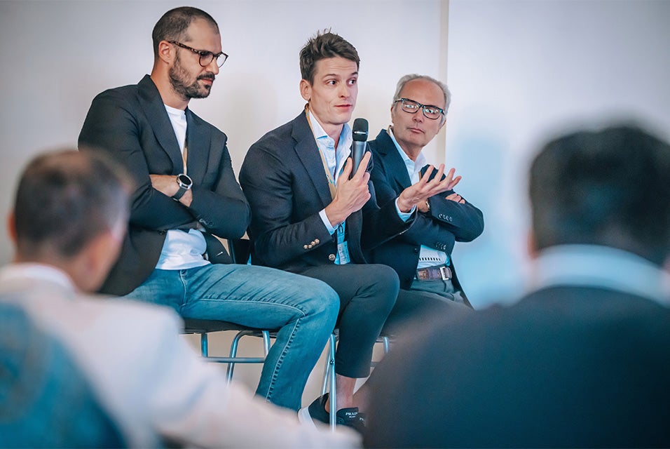 A panel of CMF surgeons sitting on stage at the Materialise CMF Innovation Summit