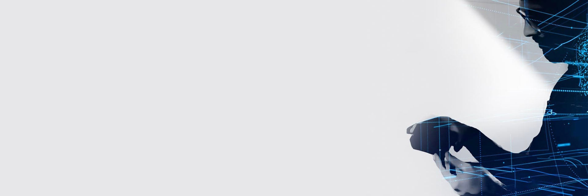 Image of a man's silhouette holding an item