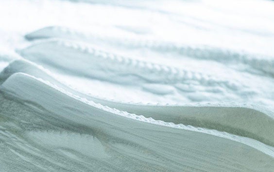 Custom orthotics in a bed of 3D printing powder