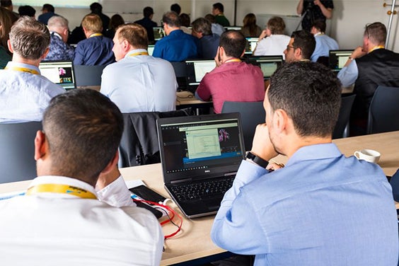 Group of attendees listening during a 3D Printing in Medicine course