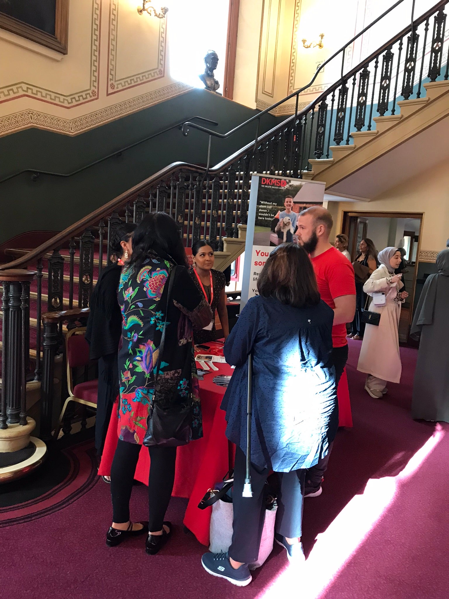 DKMS Volunteer with guests at Qawwali community event