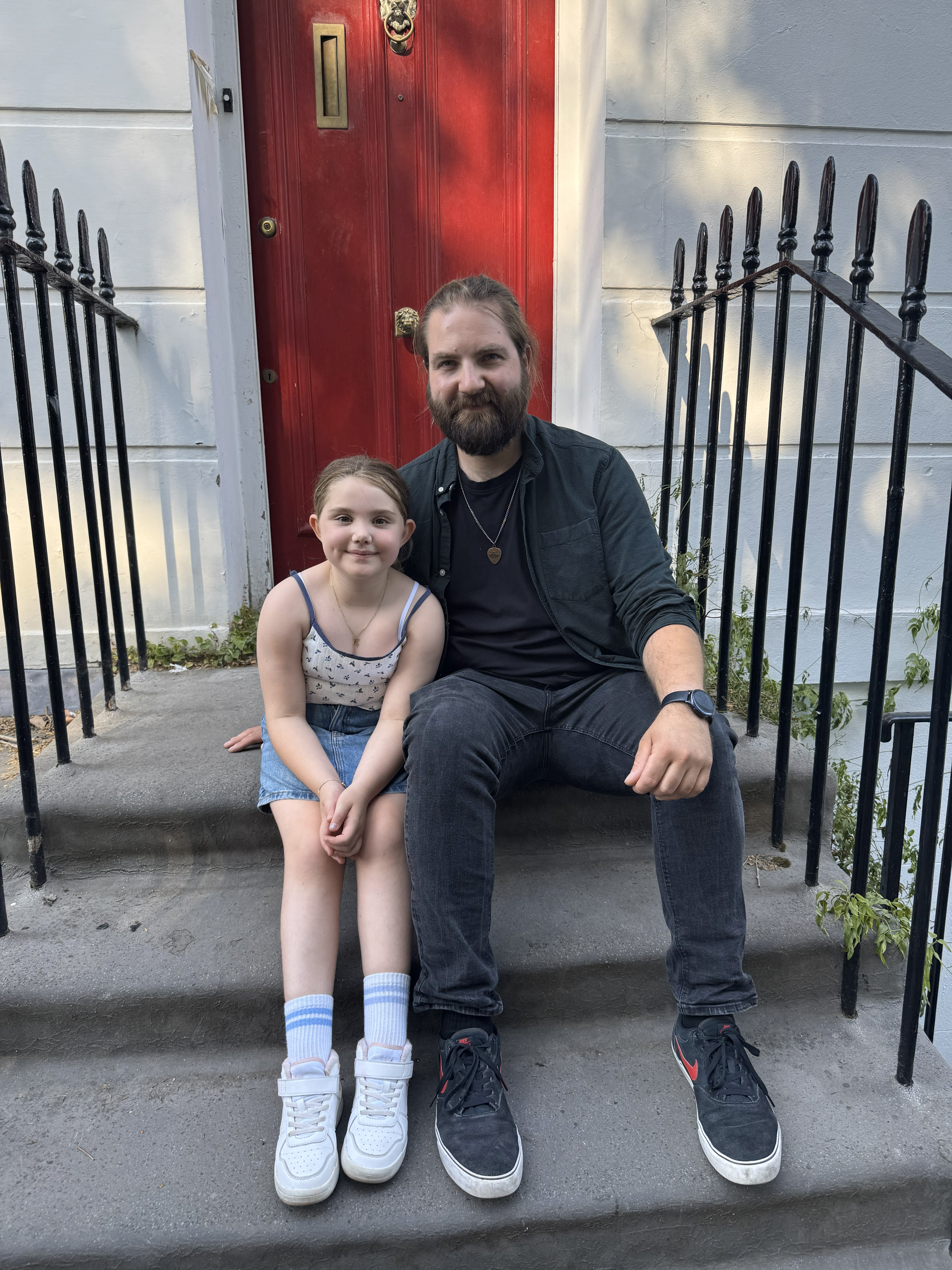 Aplastic anaemia patient, Emilia, sits with donor, Jan, on steps of the London townhouse where they first met, after he saved her life through a stem cell donation