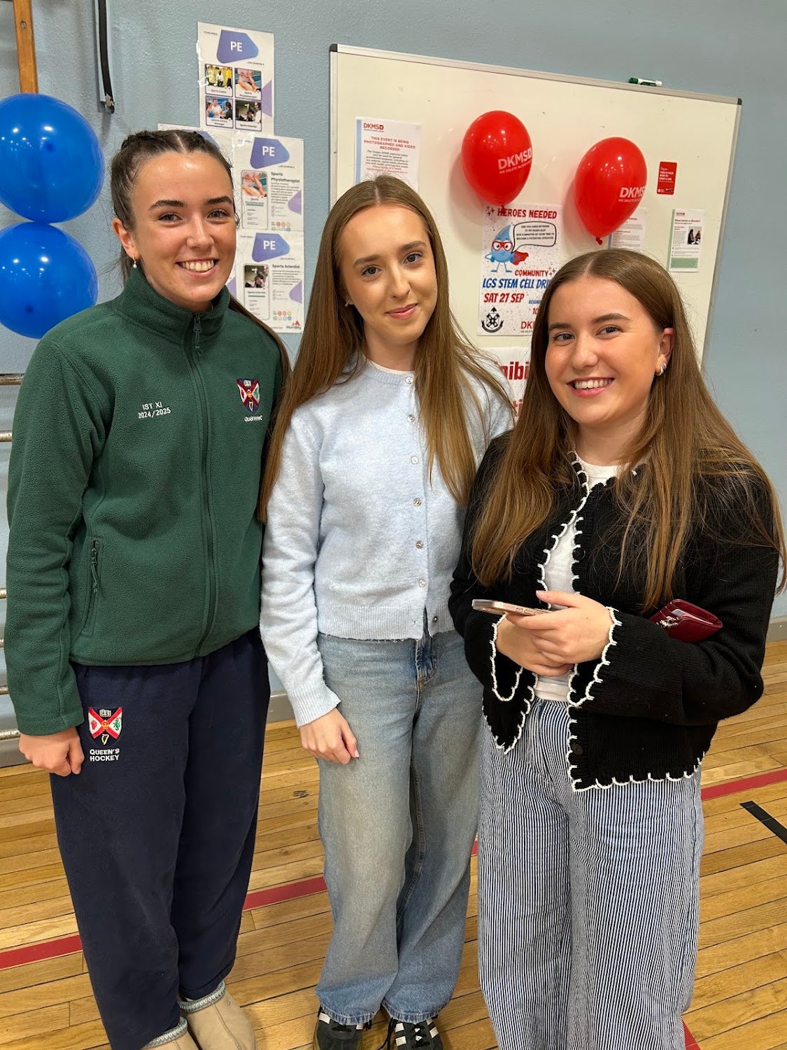 Three young girls smiling