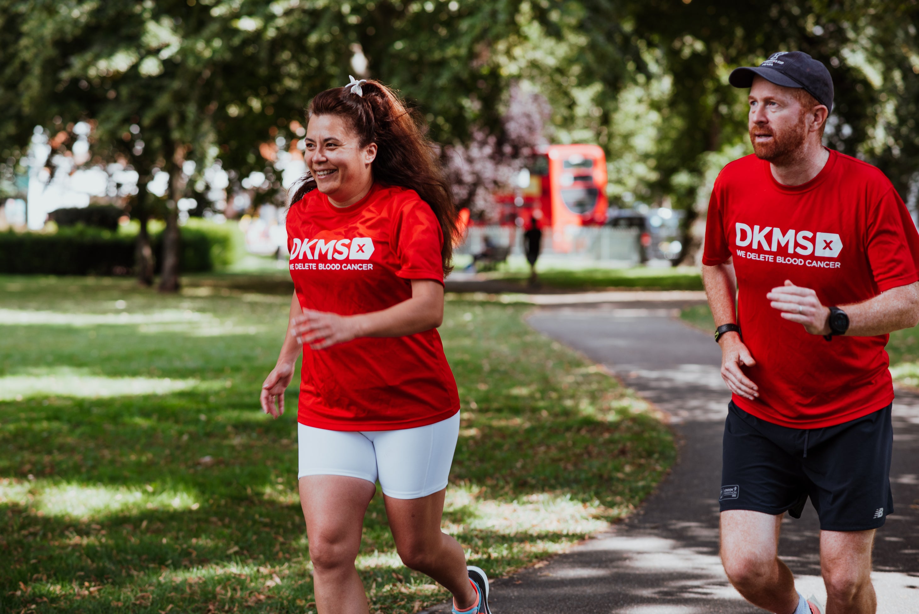 Image of two people running in DKMS t-shirts