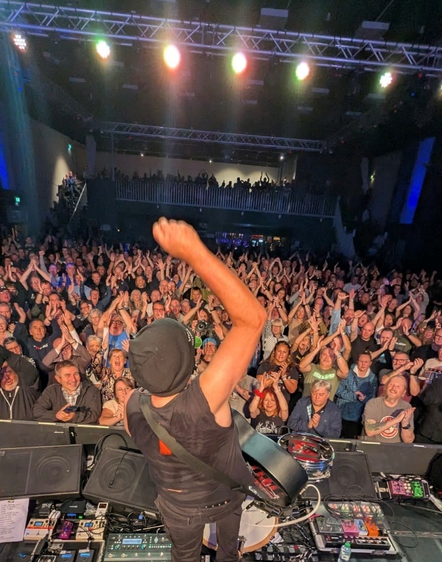 Middle aged white man at a Rock concert