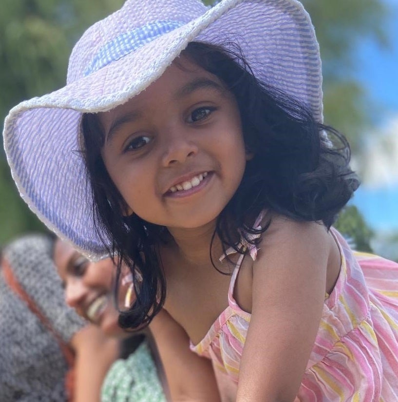 Esha in a sun hat
