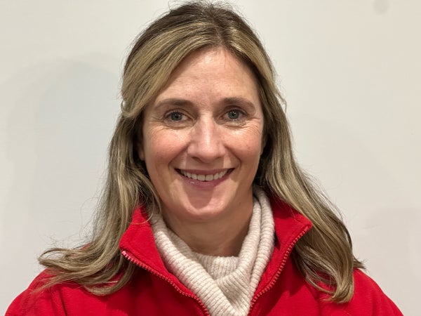 Middle aged white woman in a red sweatshirt 