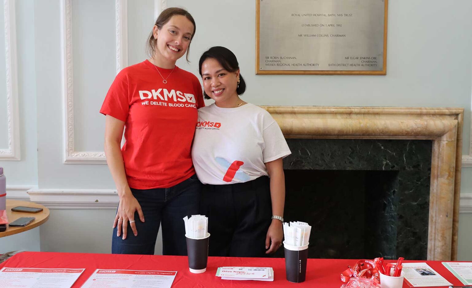 Oncology Nurse Jansen from Bath's Royal University Hospital, pictured at her donor recruitment swabbing event with Pippa from DKMS