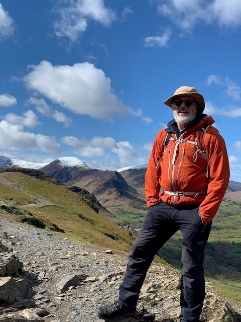 Elderly white man on a hike