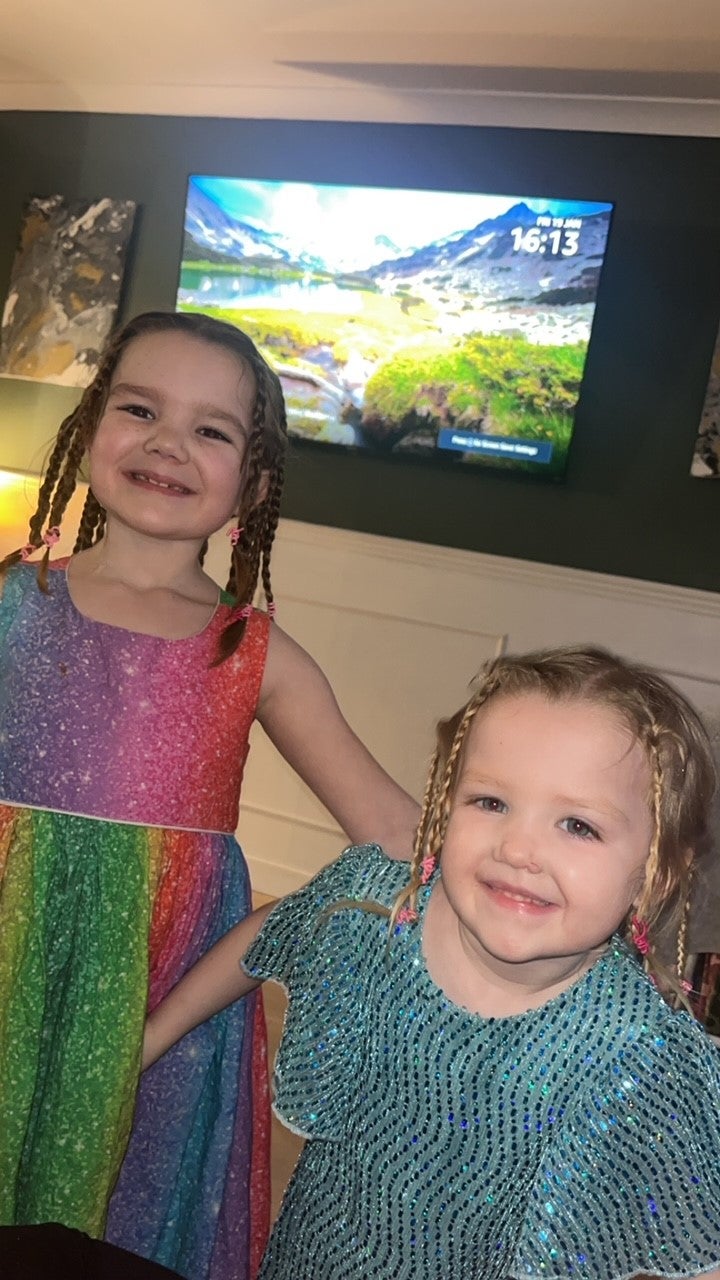 Josie smiling with her sister Adeline