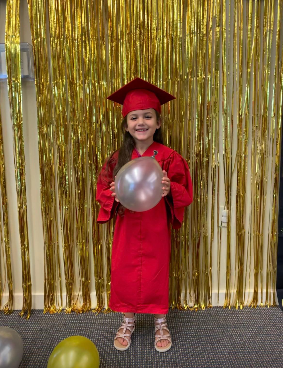 Demi holding a balloon