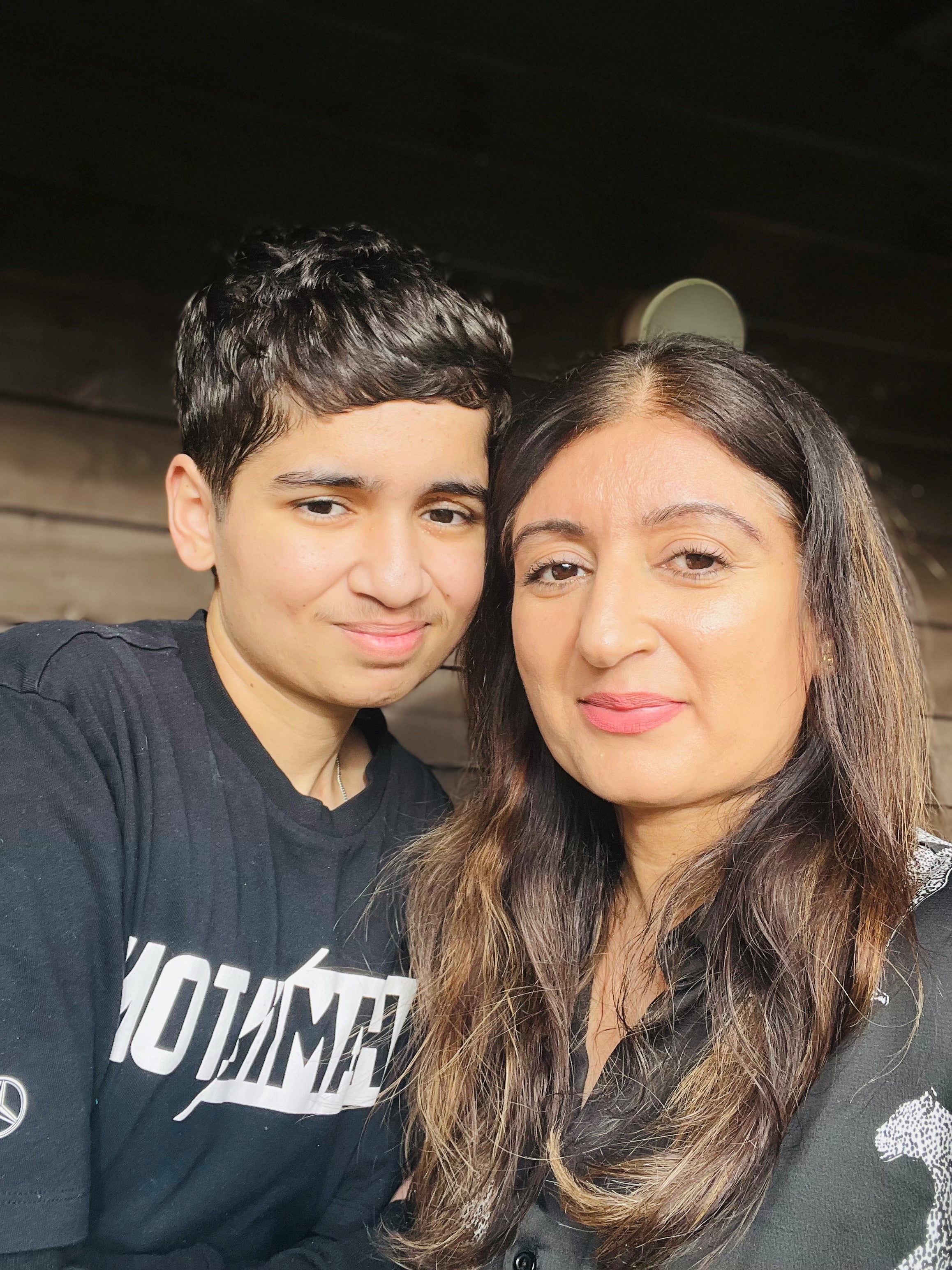 A selfie with a woman and her son smiling