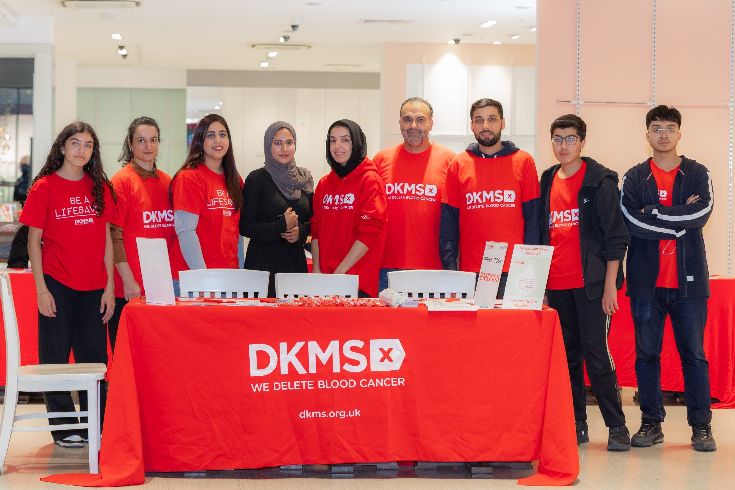DKMS volunteers at event standing together 