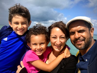 Hedley with his family enjoying the sunshine and smiling into the camera 