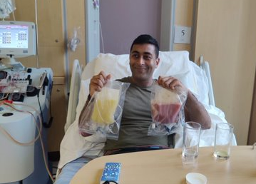 Chirag giving his donation