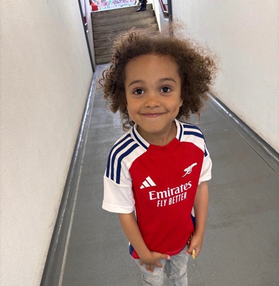 little boy wearing Arsenal T-Shirt