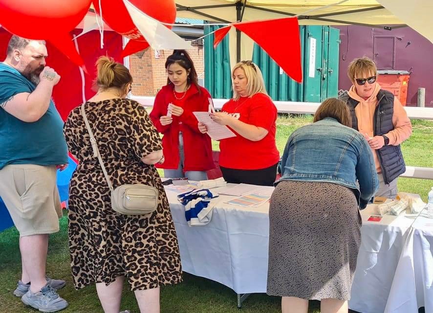 People swabbing at a DKMS registration event