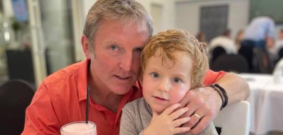 Image of Gary Stevens hugging son Jack