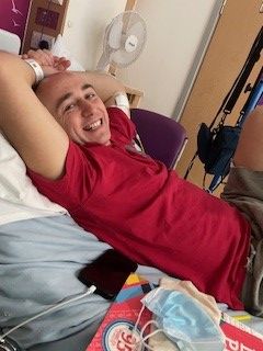 Patient Ben lying in the hospital bed