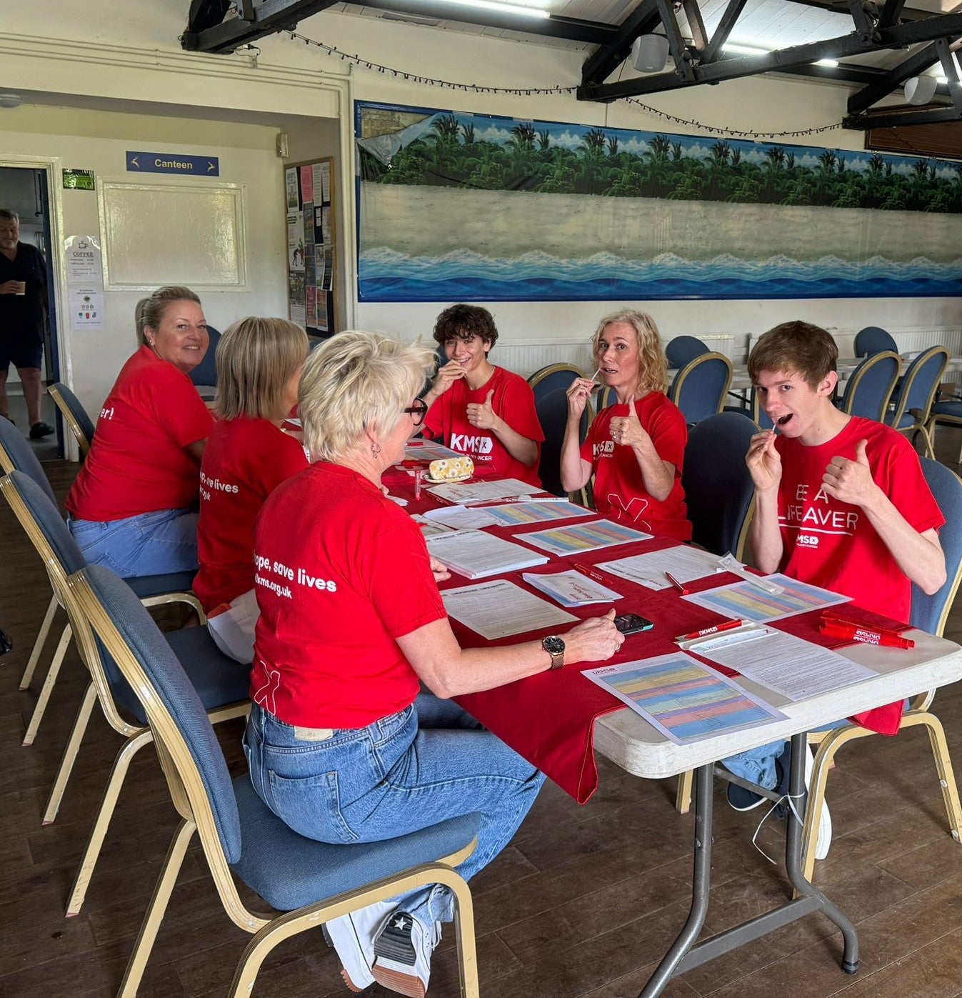 People swabbing at a stem cell registration event