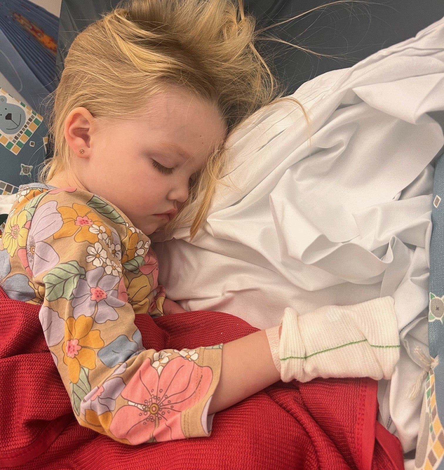 Josie lying on a hospital bed