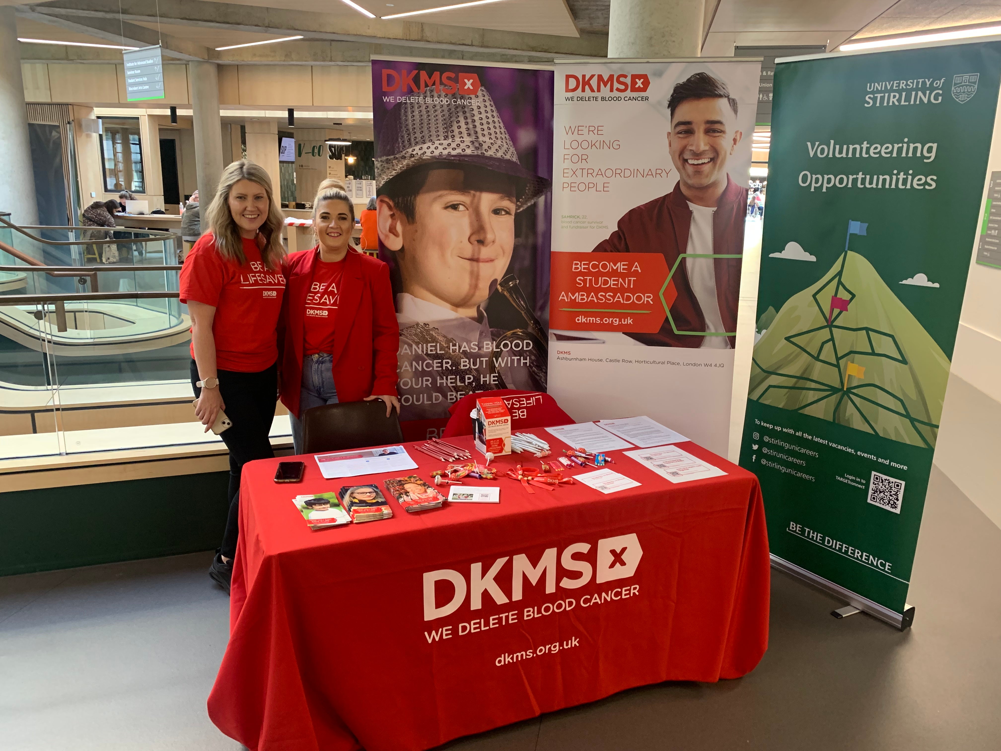 Two volunteers manning the DKMS desk Stirling University Volunteers Fair 2022
