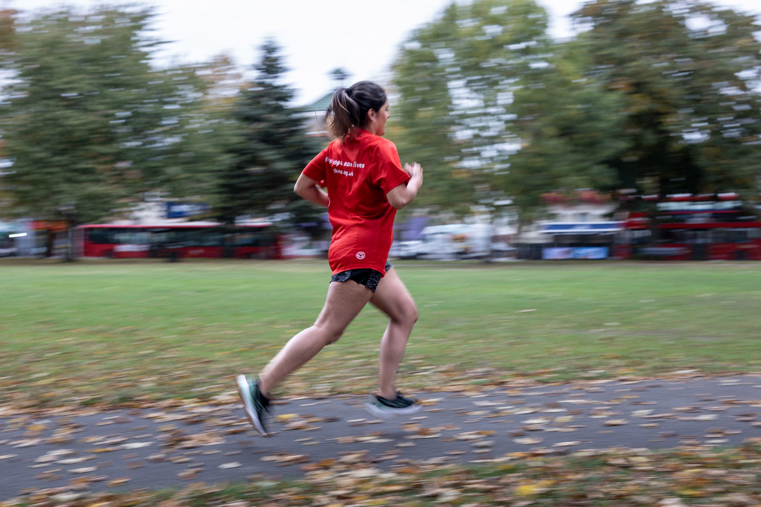 Woman running in red top