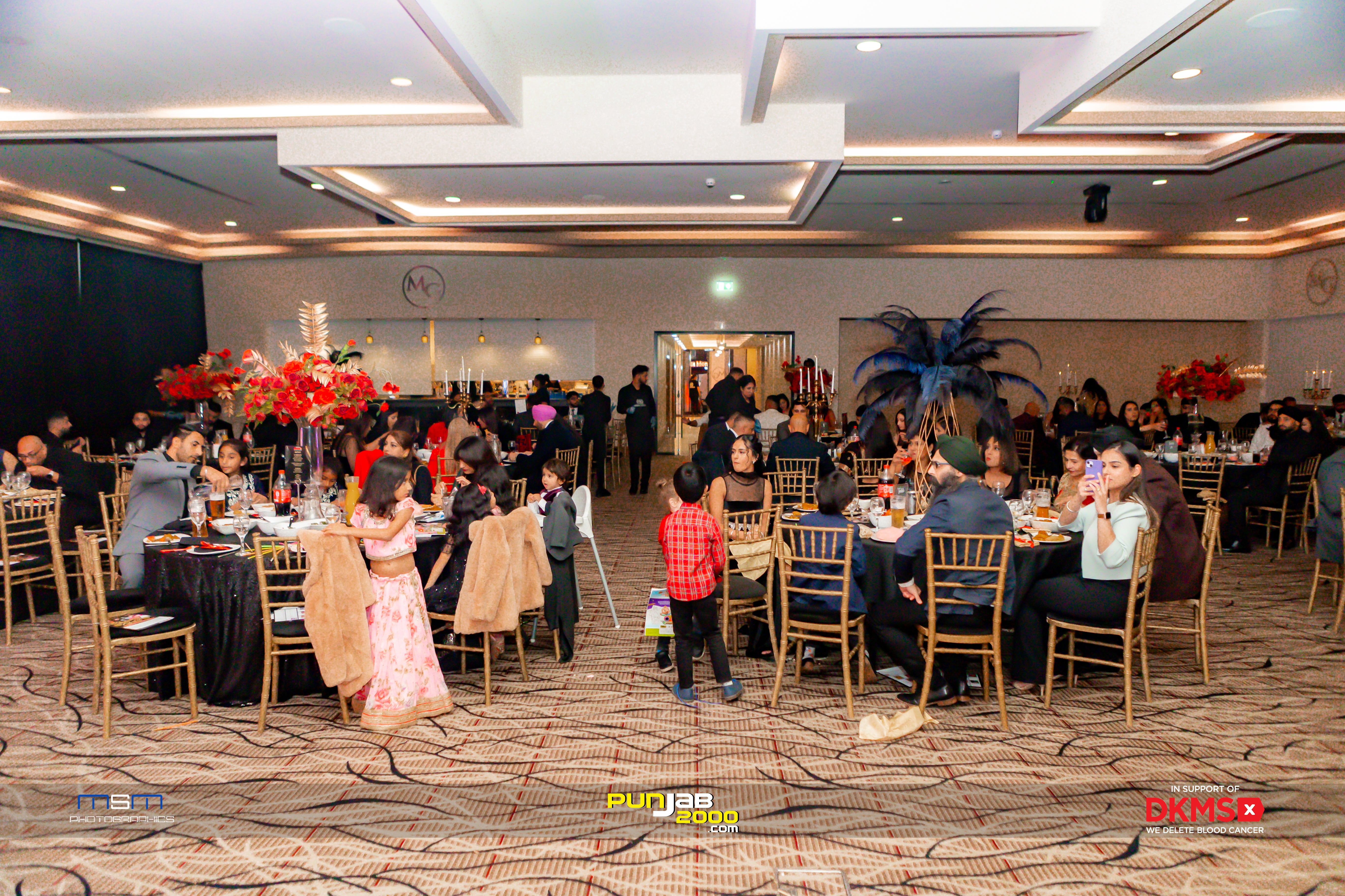 The banqueting hall filled with tables and guests