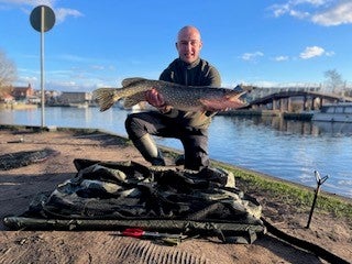 Patient Ben holding a fish