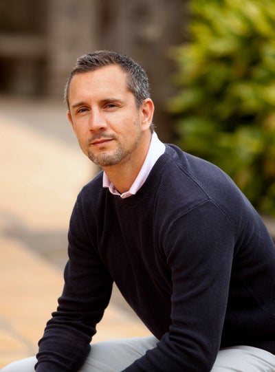 Peter McCleave the Country Manager for DKMS, sitting at a park
