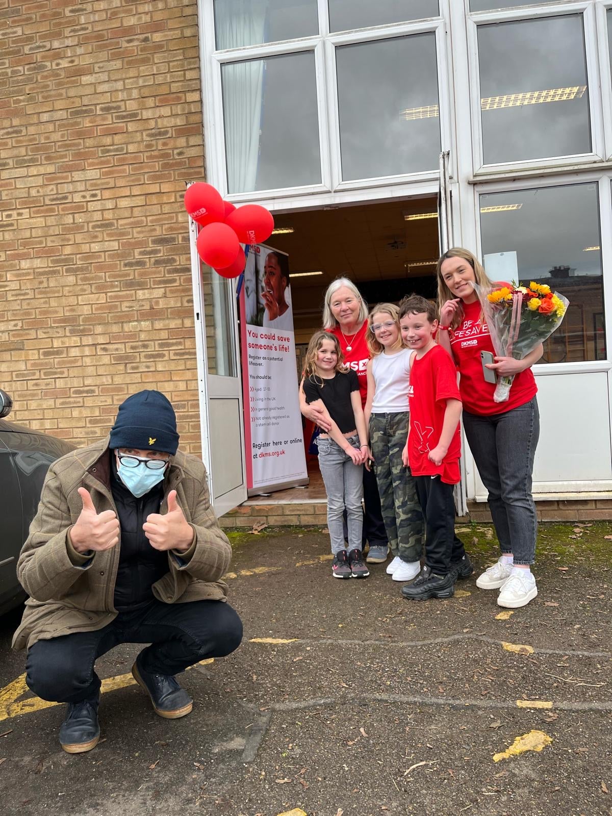 Terry smiling at the Camera with his family