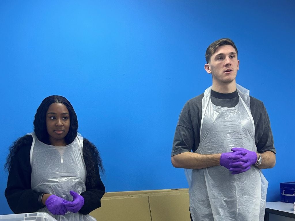 Jimmy Dunne standing with DKMS staff wearing protective gear