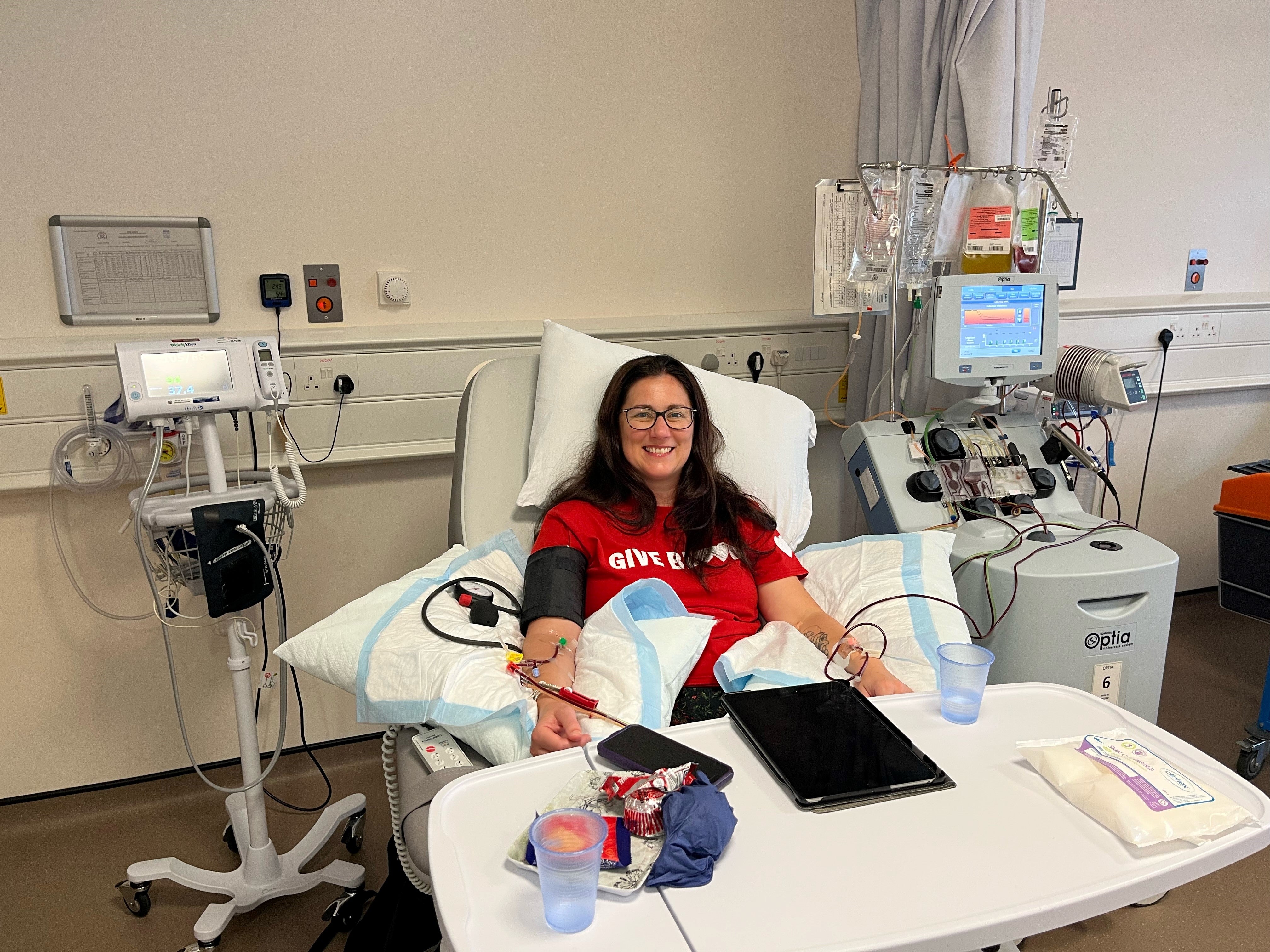 Gemma giving her donation at Edinburgh