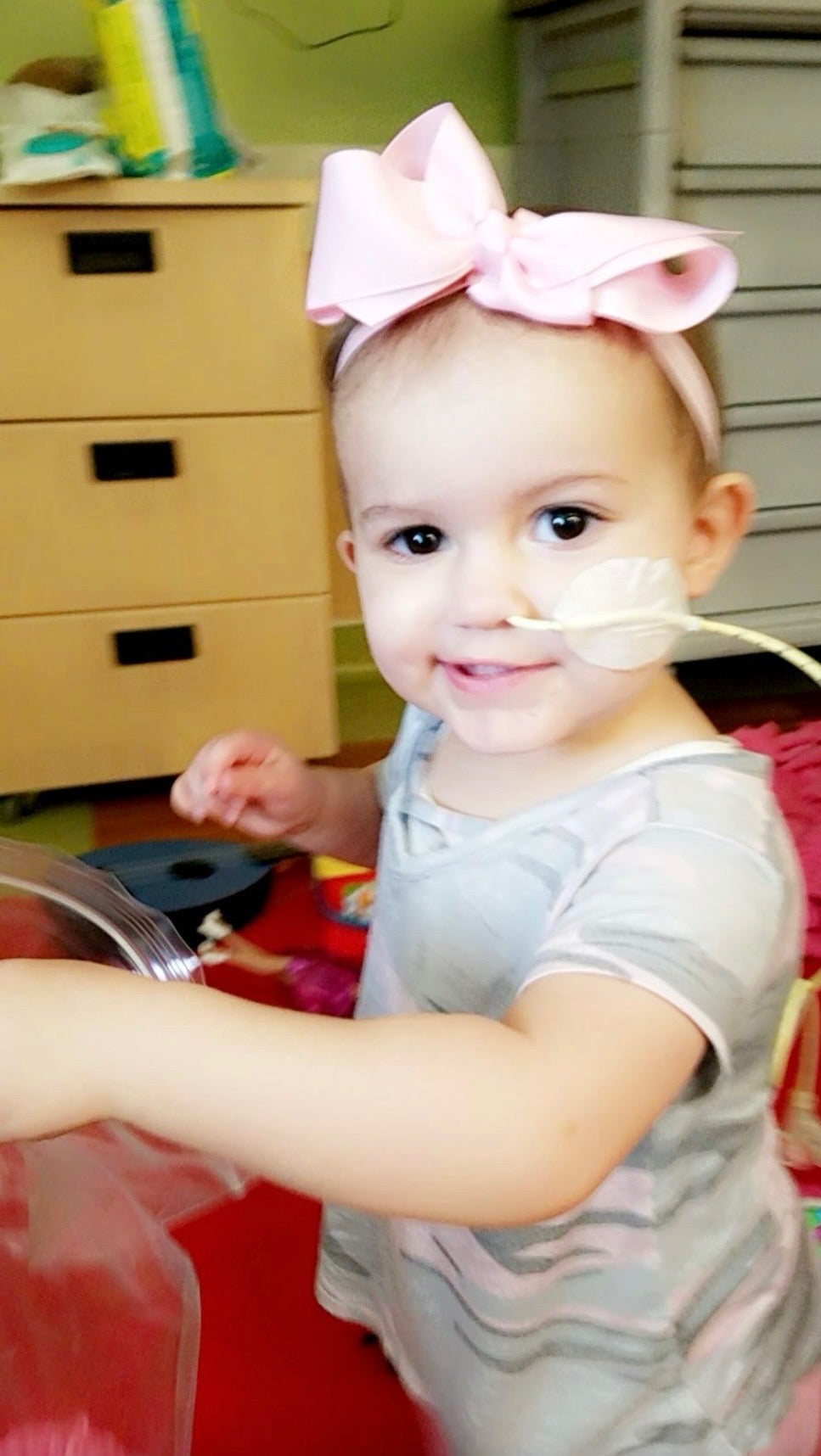 Little girl with a nose tube