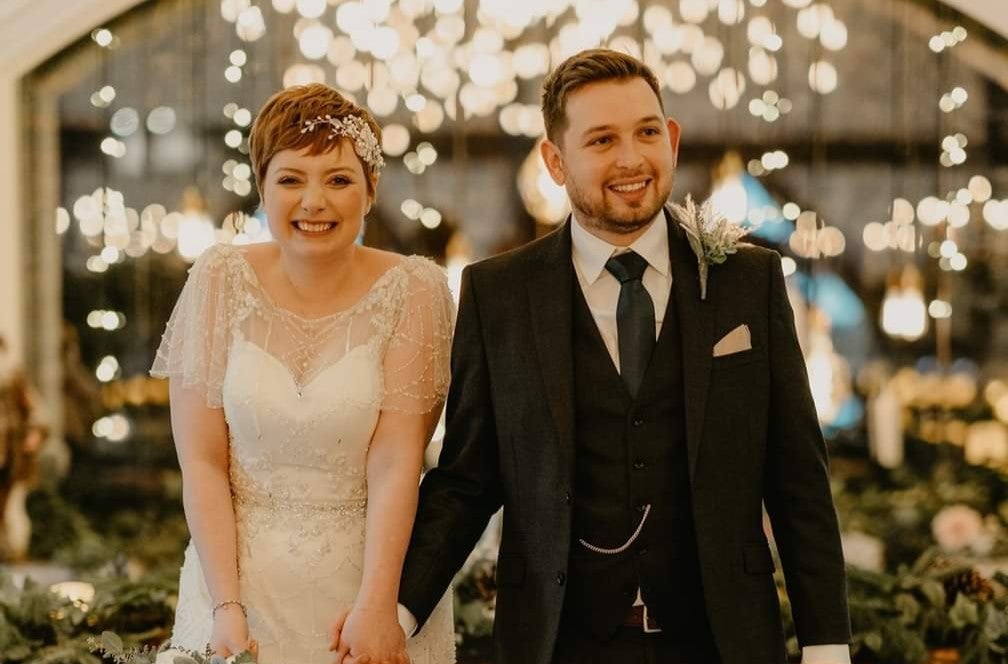 Lauren and her husband on their wedding day a few years after her stem cell transplant