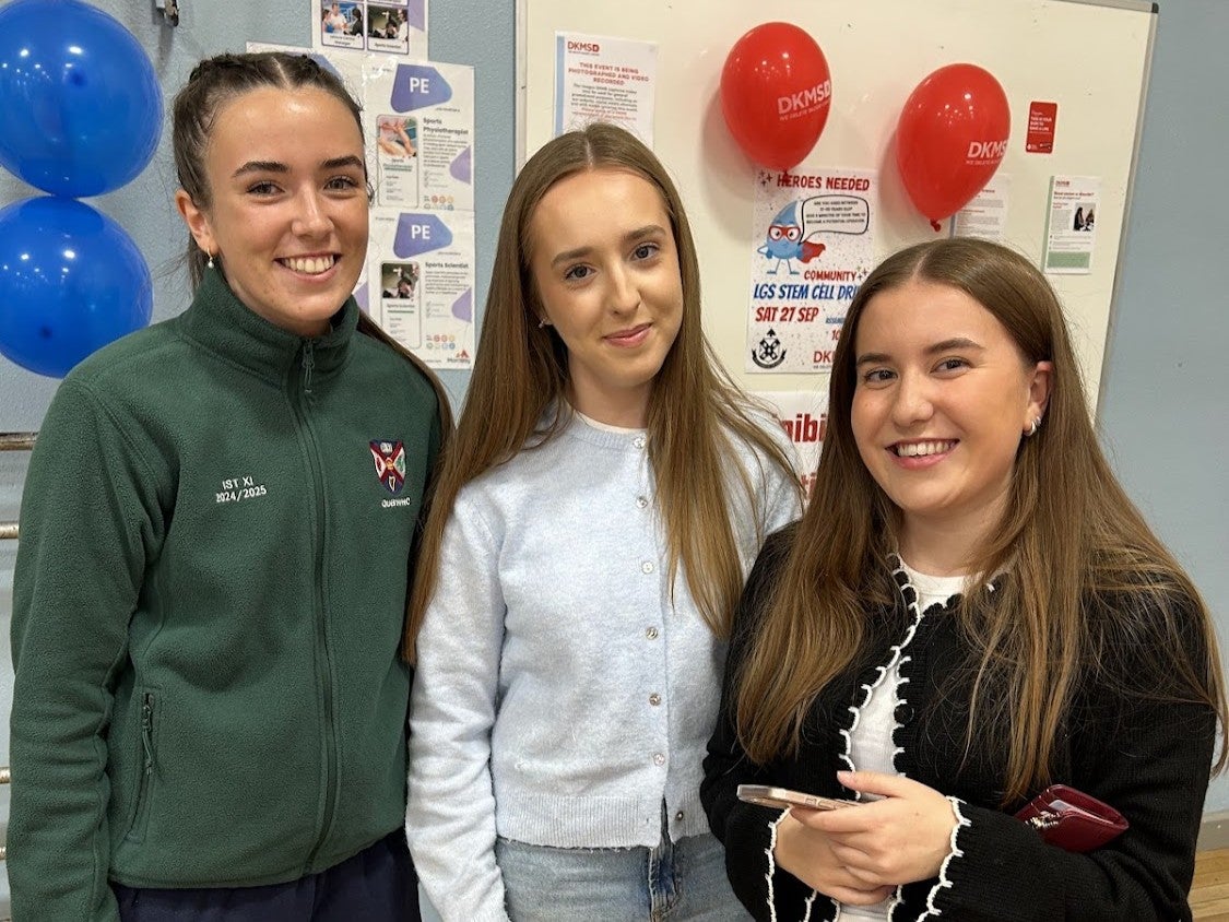 Three young girls smiling