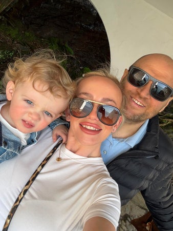 Pictured (right to left) is Sean Turner, AML patient and Second Stem Cell Transplant Campaigner) with his wife, Rebecca, and son, Jimmy. All are smiling at the camera in this family selfie, and Sean and Rebecca are wearing sunglasses.