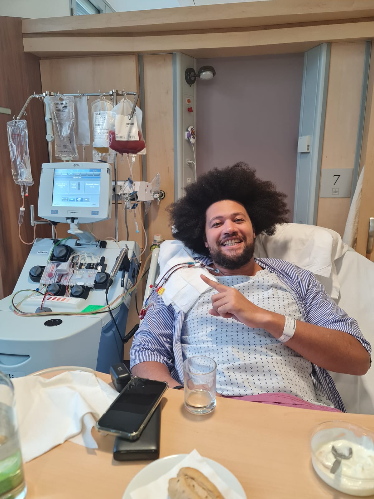 Fraser lying on hospital bed giving hs donation