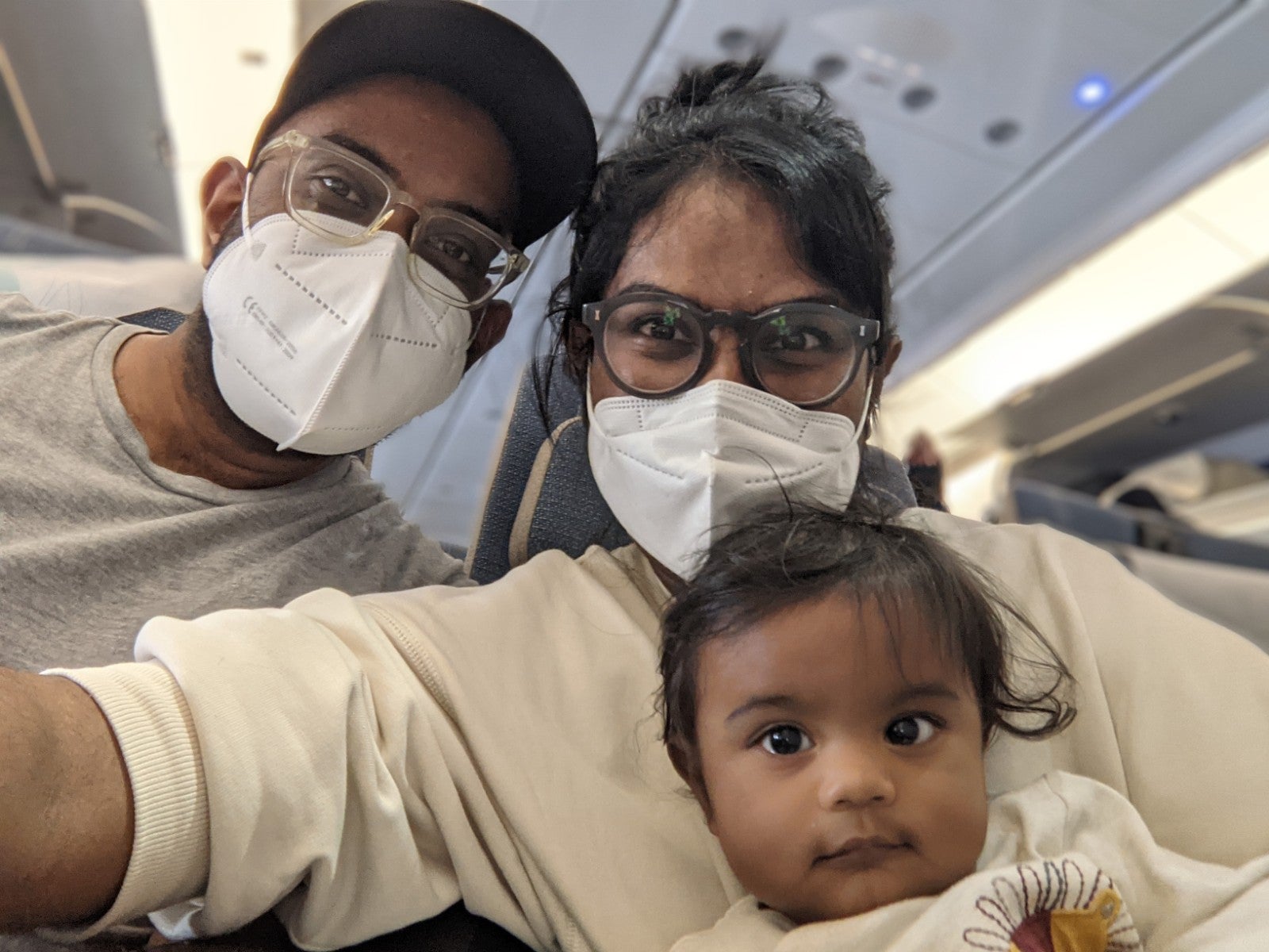 Image of Evie with her parents 