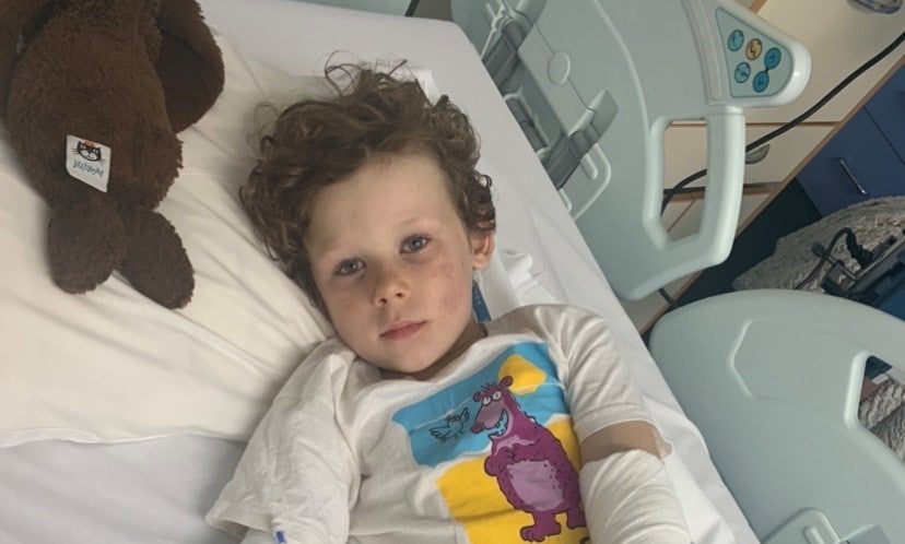 Image of Olcán in hospital bed 