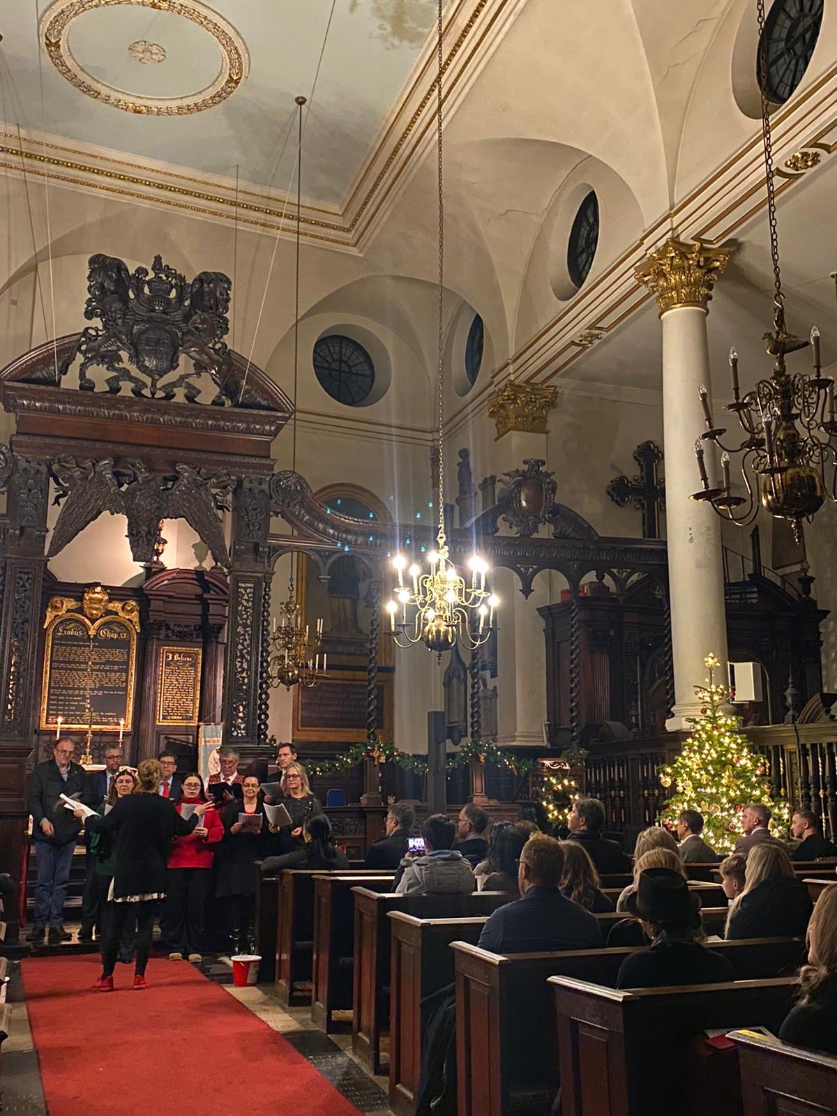 Congregation sitting in the pews of St Margaret's listening to the choir